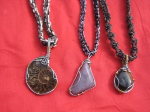 Ammonite, lepidolite, and tiger's eye necklaces. These pendants were wrapped by a young artist out of Taos, NM named James Smith.