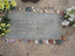 Many of the graves in the cemetery are decorated with local stones.