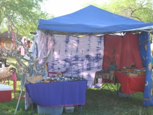 I took this photo of my vending setup at NeoTribal The Gathering. I put up the curtain walls to block the sun, but they also gave me a tiny bit of privacy at night.